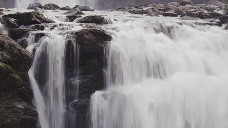 Whitewater-is-cascading-over-the-dark-rocks-at-the-Storfossen-waterfall