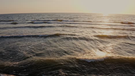 sunset over the ocean waves