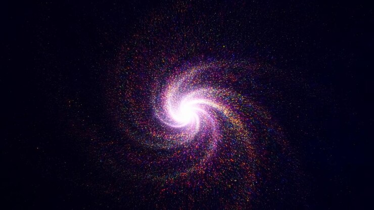 Partikel multiwarna yang berputar membentuk spiral bercahaya di sekitar pusat terang dengan latar belakang gelap