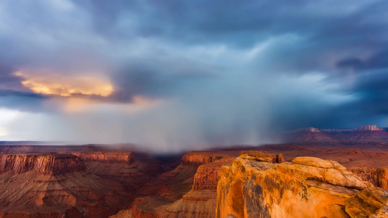 Stormy Sky Over Canyon Rim, Dramatic Sunset Light Paints Red Cliffs, Thunderclouds Sweeping Across Vast Desert