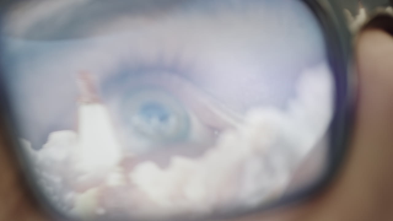 Close-up view of a person's eye through eyeglasses