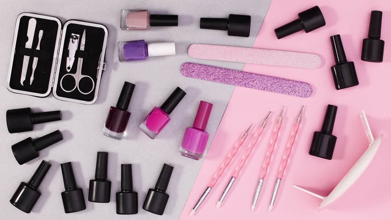 Gel nail polishes and manicure tools move on silver pink theme. Stop motion