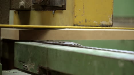 close up shot of side of chipboard elements on production line