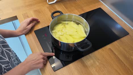 boiling potatoes on a cooktop