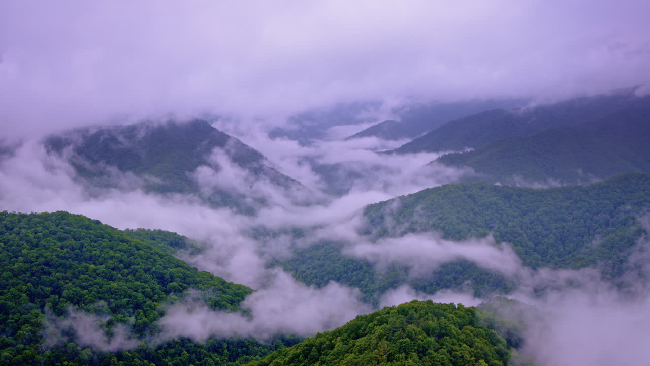 Vast layers of fog ripple through the Smoky range, captured by drone