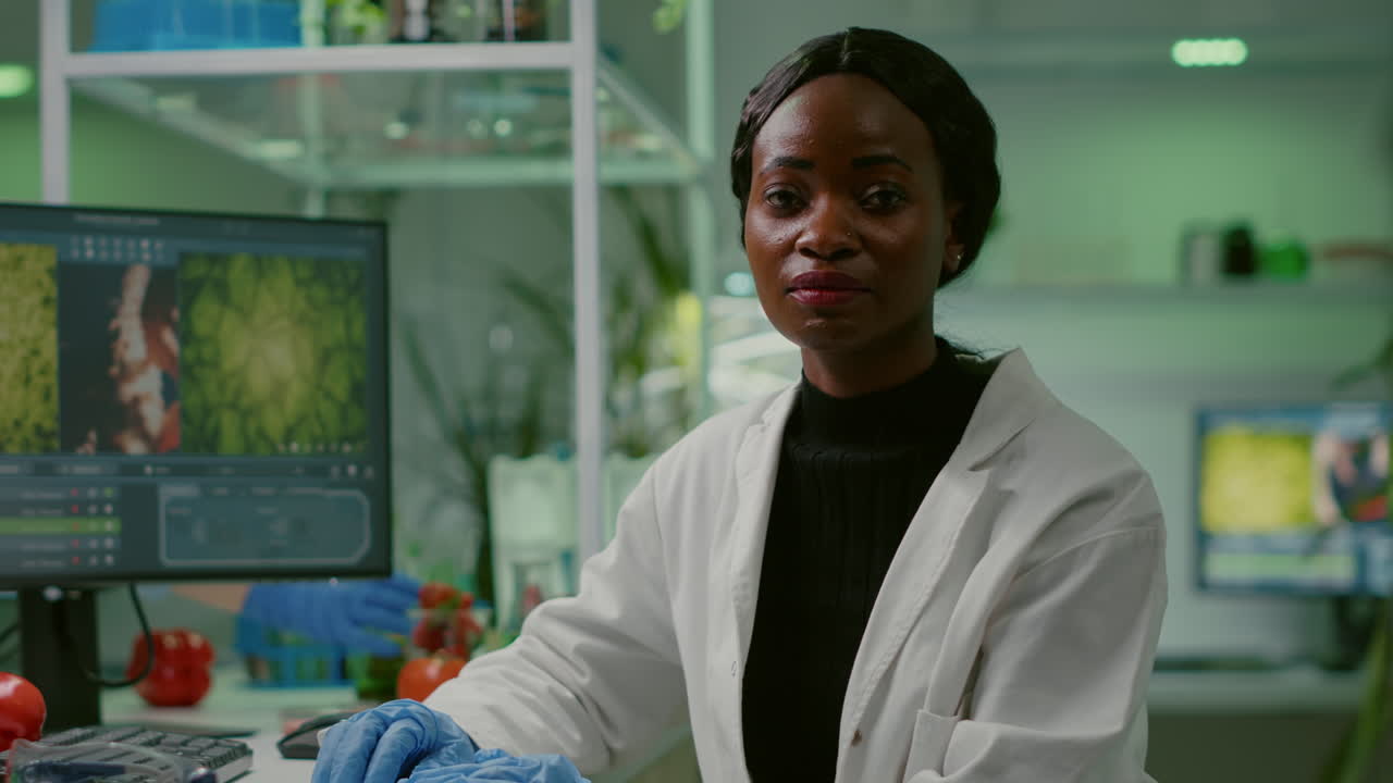 Closeup of african biologist woman looking into camera