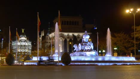 spain night light plaza de la cibeles fountain metropolis hotel 4k