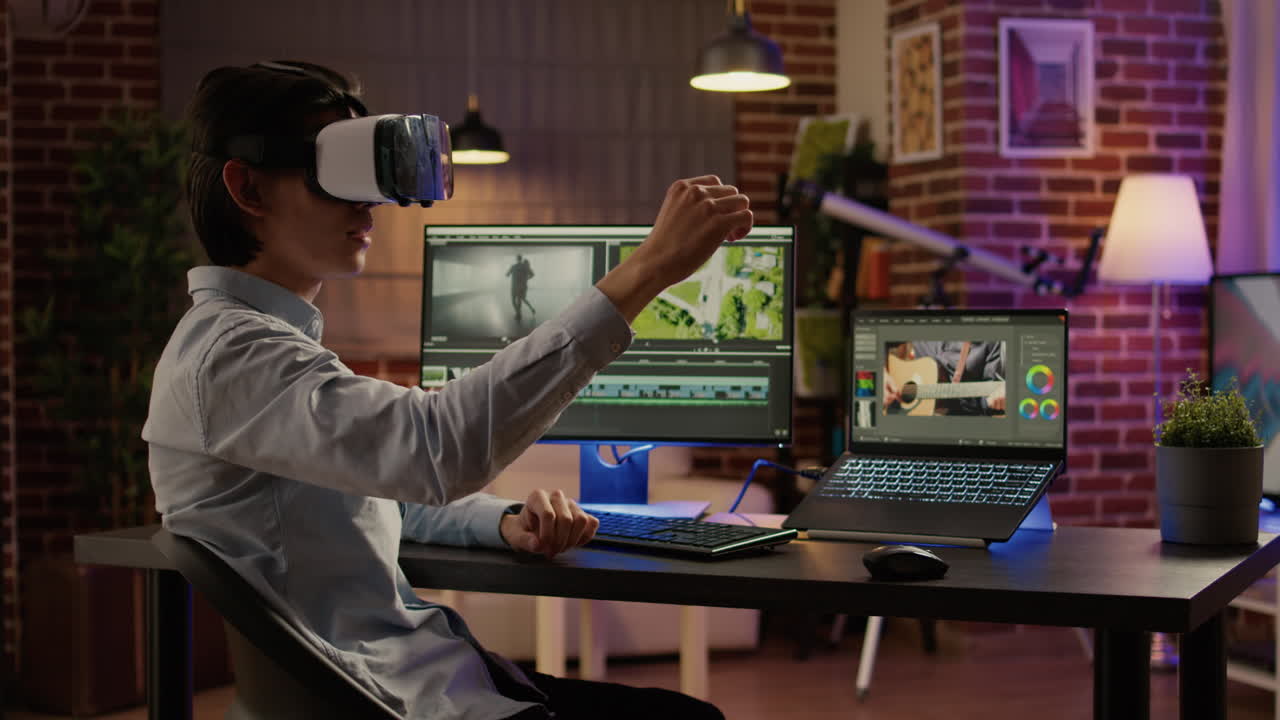 Man Using VR Headset Editing Video on Computer