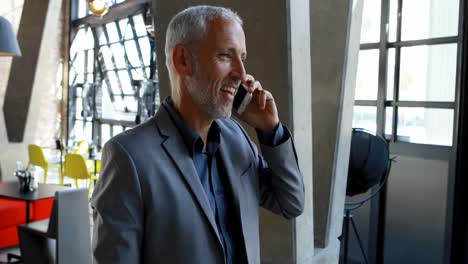 businessman talking on mobile phone in hotel 4k