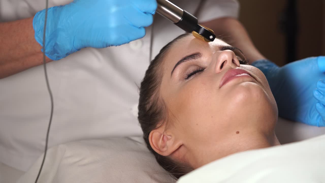 Woman Receiving Micro-needling Facial Treatment