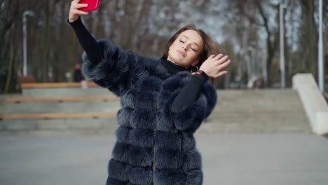 young woman taking selfie. city stylish portrait of beautiful woman making selfie at the street