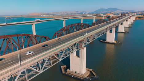bridges connecting martinez to benicia in california, united states. mountainous landscape at backdrop. clear sunny day backdrop.