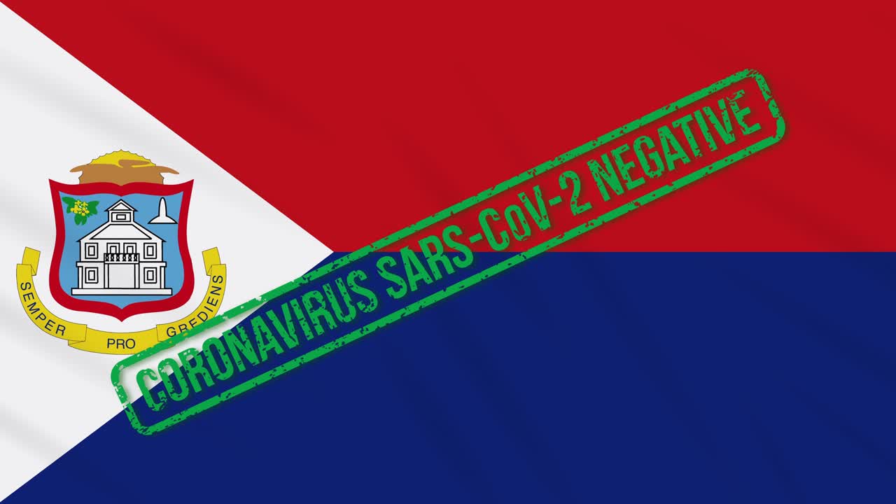 신트 마르틴은 코로나 바이러스로부터 자유를 표시하는 녹색 스프를 가진 발을 흔들고 있습니다.