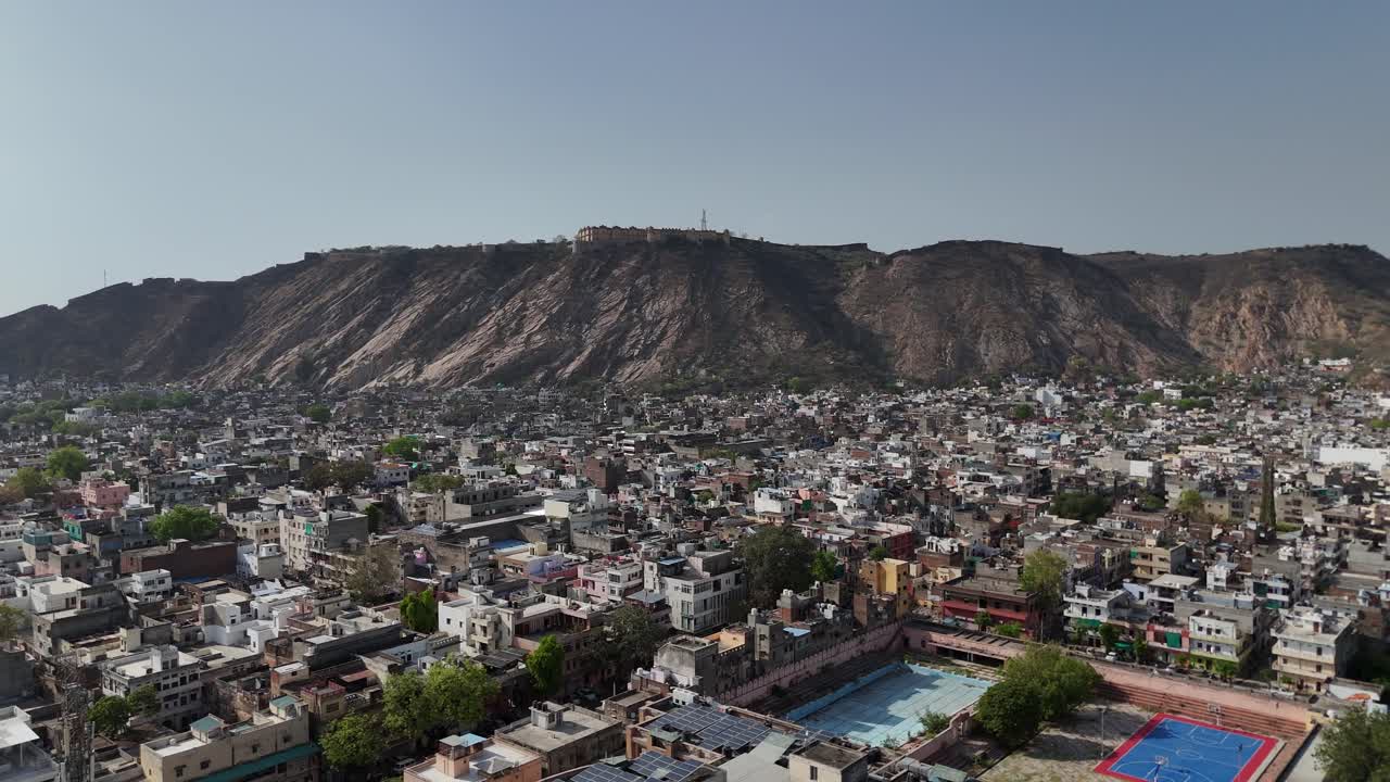 Overhead shot capturing the dramatic, rocky terrain surrounding the ancient fort walls.