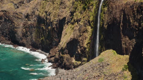 scenic waterfall miradouro do veu da noiva on the coast of madeira, portugal - static shot