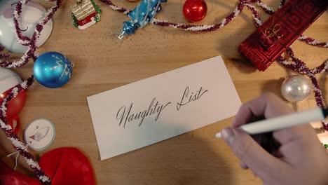 handwritten christmas letter that says naughty