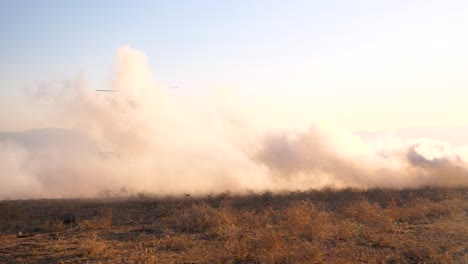 israeli blackhawk helicopter landing in gaza on field designated by smoke