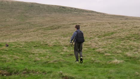 Young-boy-outdoors-on-the-moors-playing-with-his-RC-Car,-Truck,-4-x-4