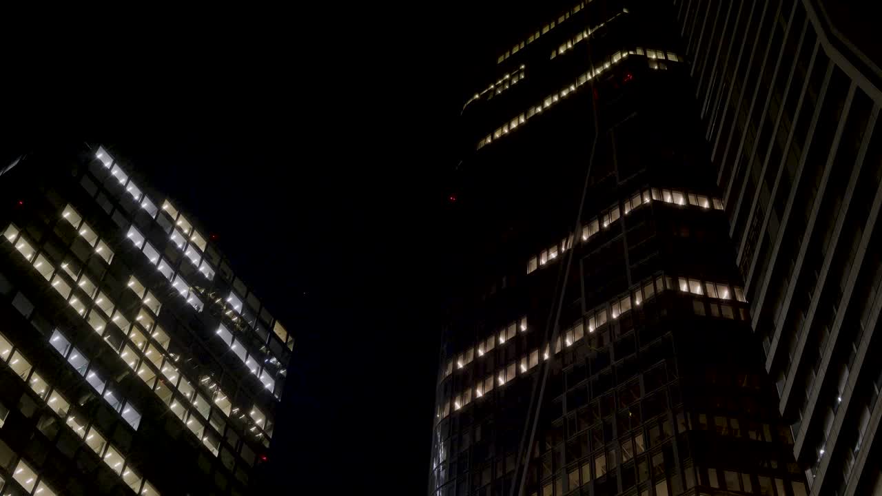 Night view of illuminated skyscrapers in Frankfurt, Germany with modern city lights