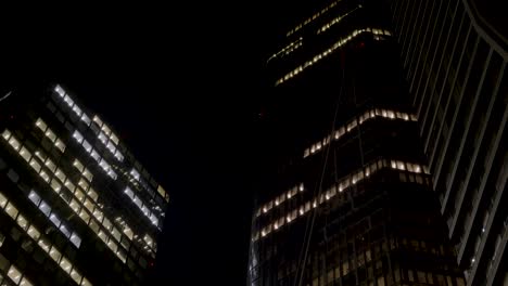 night view of illuminated skyscrapers in frankfurt, germany with modern city lights