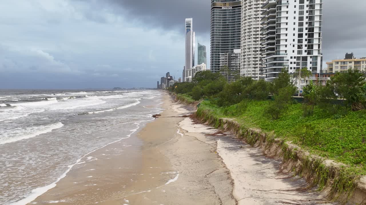 Coastal City Beach View with High-Rise Buildings and Erosion