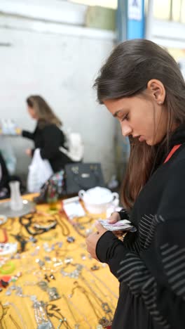 teenage girl shopping at a market