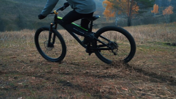 Male Cyclist Skidding Riding A Mountain Bike Down The Road In The Countryside 1