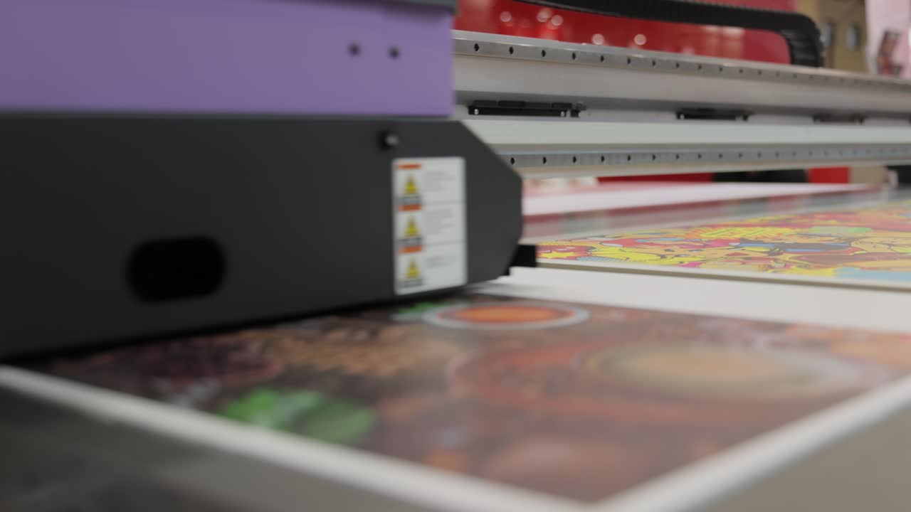 Modern Digital Large format UV printer. Printing production technologies. UV pinning is the process of applying a dose of low intensity ultraviolet light to a UV curable ink