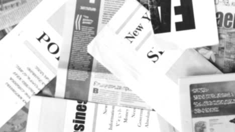 abstract animation of blurred newspaper pages with headlines and articles shown in random order