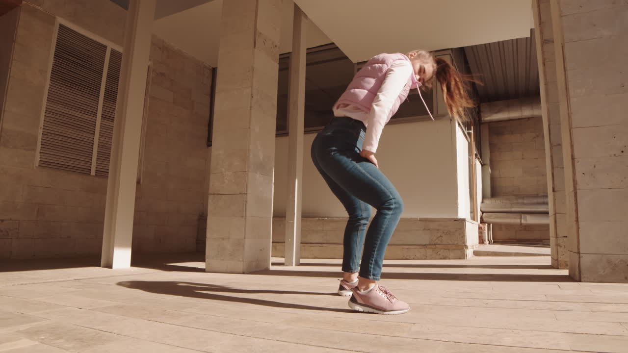 Caucasian Woman Dancing by Building