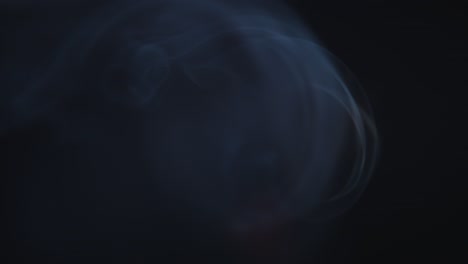 atmospheric smoke 4k fog effect. smoke in slow motion on black background. white smoke slowly floating through space against black background