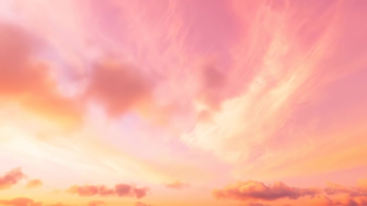 Vivaci nuvole rosa e arancioni al tramonto che si muovono nel cielo