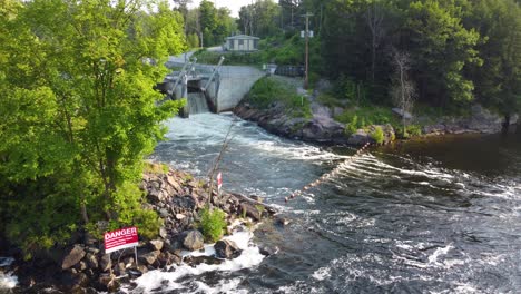 Aerial-View-Of-Water-Flowing-Over-Wasdell-Falls-Wier,-Ontario-Canada