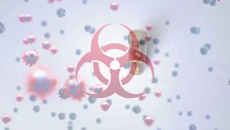 Animation-of-floating-macro-Covid-19-cells-and-biohazard-symbol-over-falling-box-of-pills