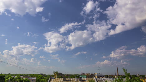 Cloudscape-timelapse-over-rooftops-in-Riga,-Latvia,-cumulus-clouds-on-blue-sky