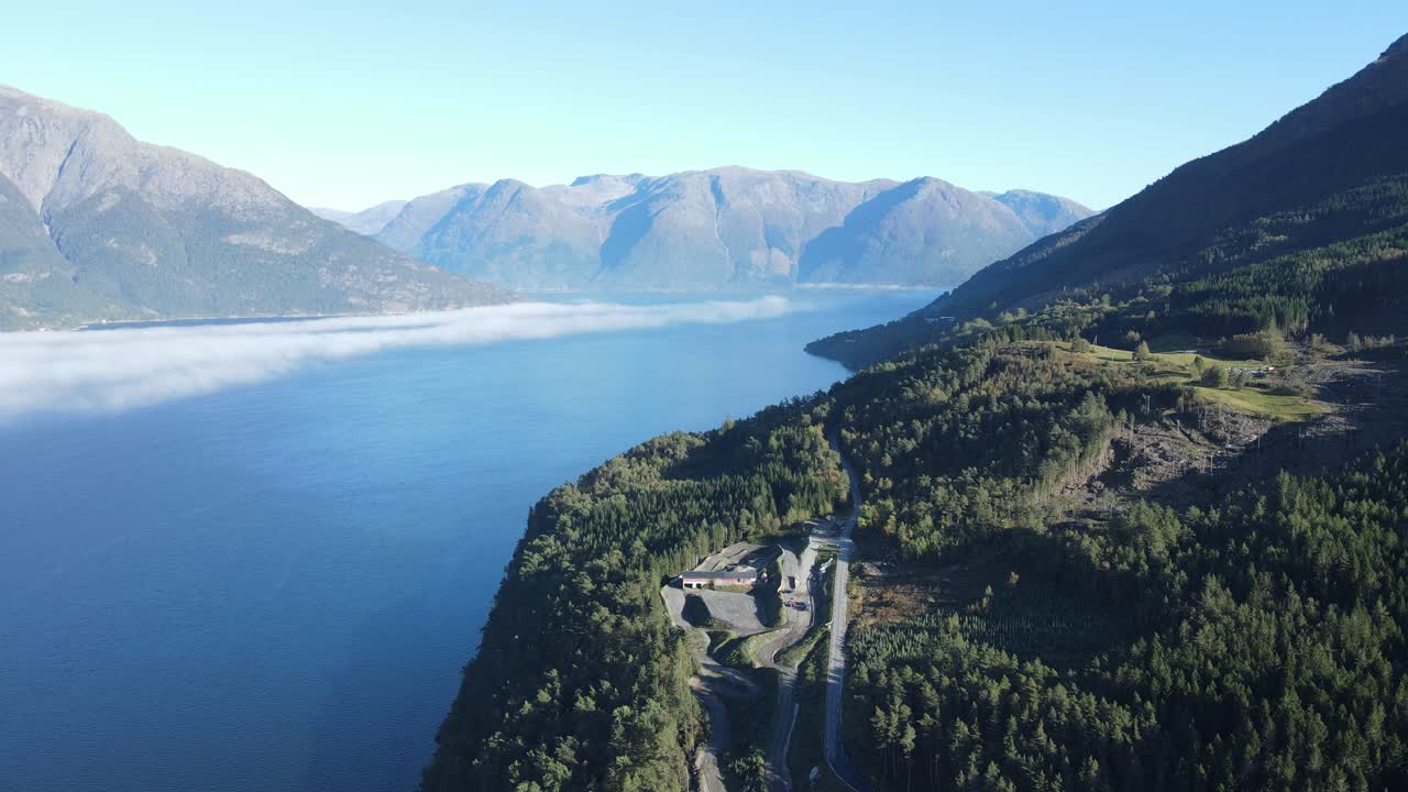 Zooming out drone footage of a fjord in Norway