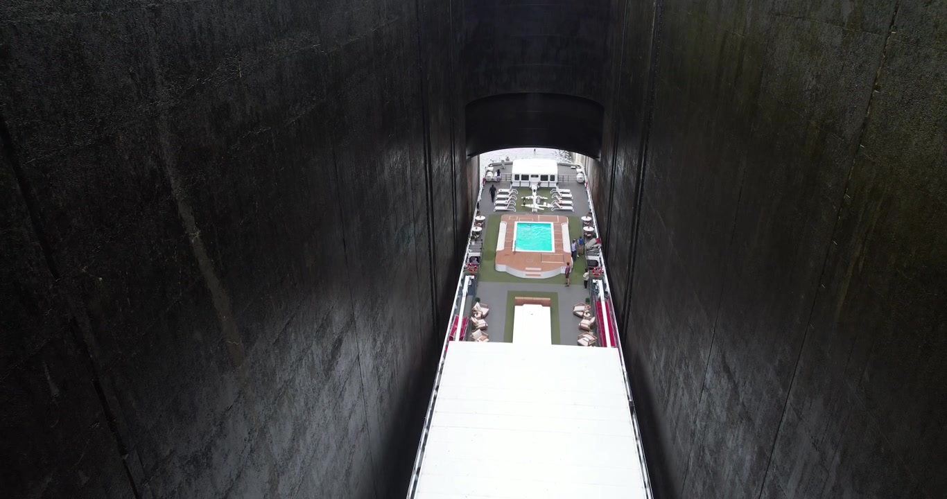 Aerial View of Boat Passing Through Water Dam