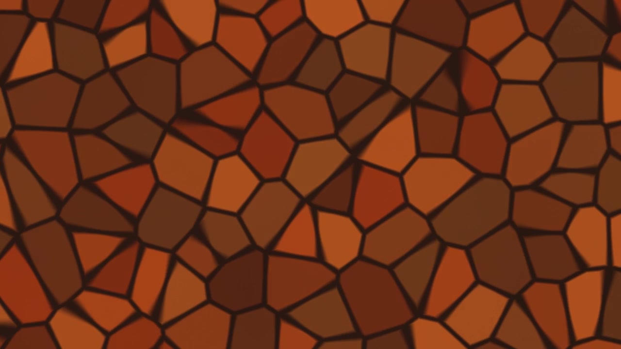 Una vista ravvicinata di un motivo a mosaico composto da forme irregolari in varie tonalità di arancione e marrone. Il design presenta un mix di texture e toni, creando interesse visivo