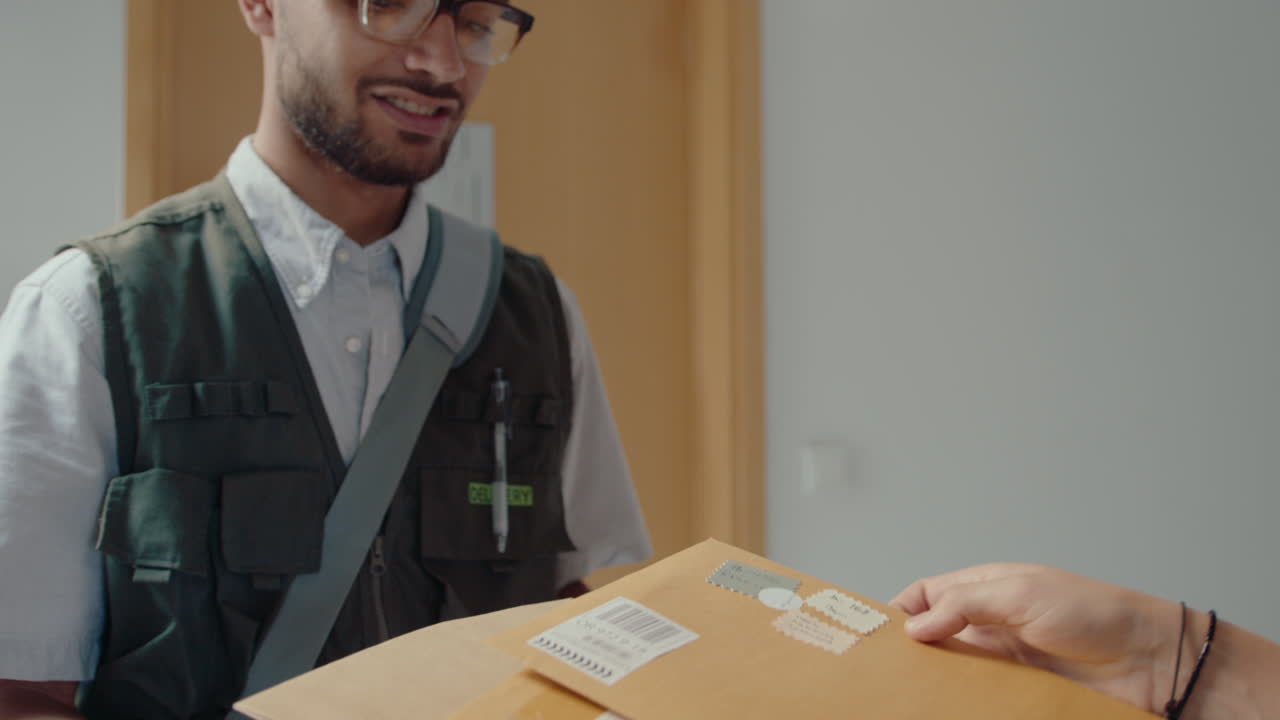 Postal Worker Delivering Express Mail to Recipient at Home