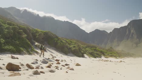 sporty mixed race man with prosthetic leg hiking