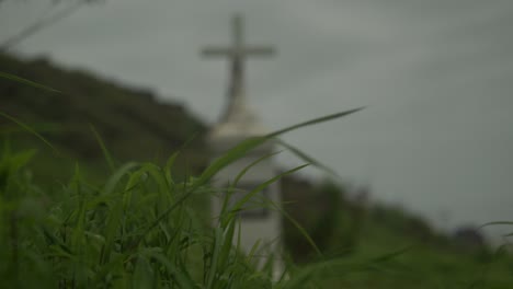 out of focus monument, cross in the hills