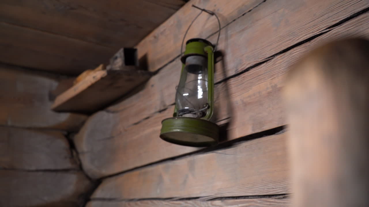 Rustic Wooden Cabin Interior with Old Lamp