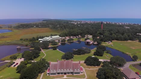 Aerial-Drone-Shot-of-Currituck-Lighthouse,-Outer-Banks-Center-for-Wildlife-Education,-Whalehead-Club-and-Historic-Corolla-Park