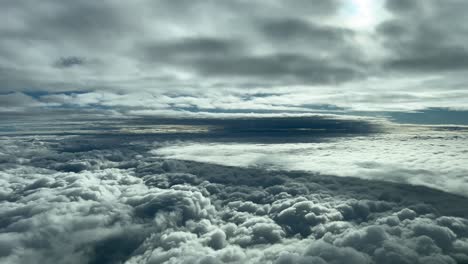 flying thrtough layers of clouds in a autumn morning with a sky plenty of grey and white clouds