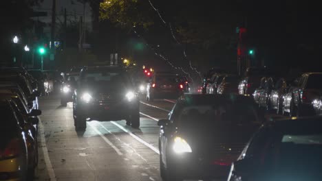 Baltimore-Avenue-Traffic,-Cars,-Headlights,-night,-West-Philadelphia