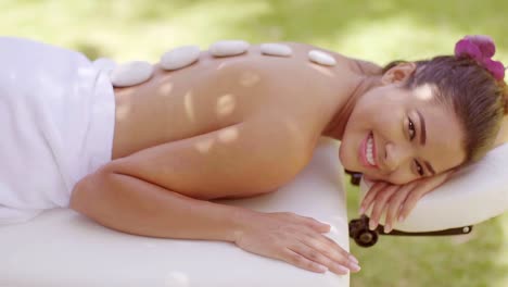 Relaxed-young-woman-with-a-flower-in-her-hair