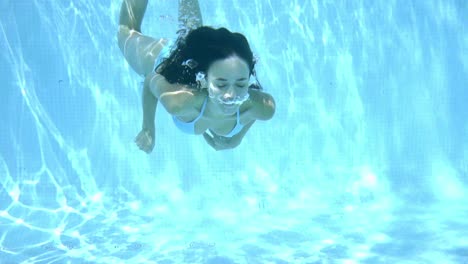 Happy-young-woman-smiling-underwater