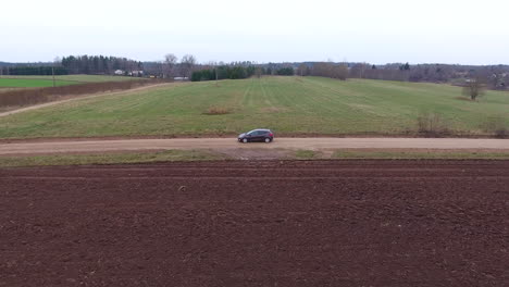 Sideways-drone-shot,-car-driving