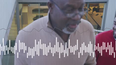 animation of data processing over diverse business people working at office