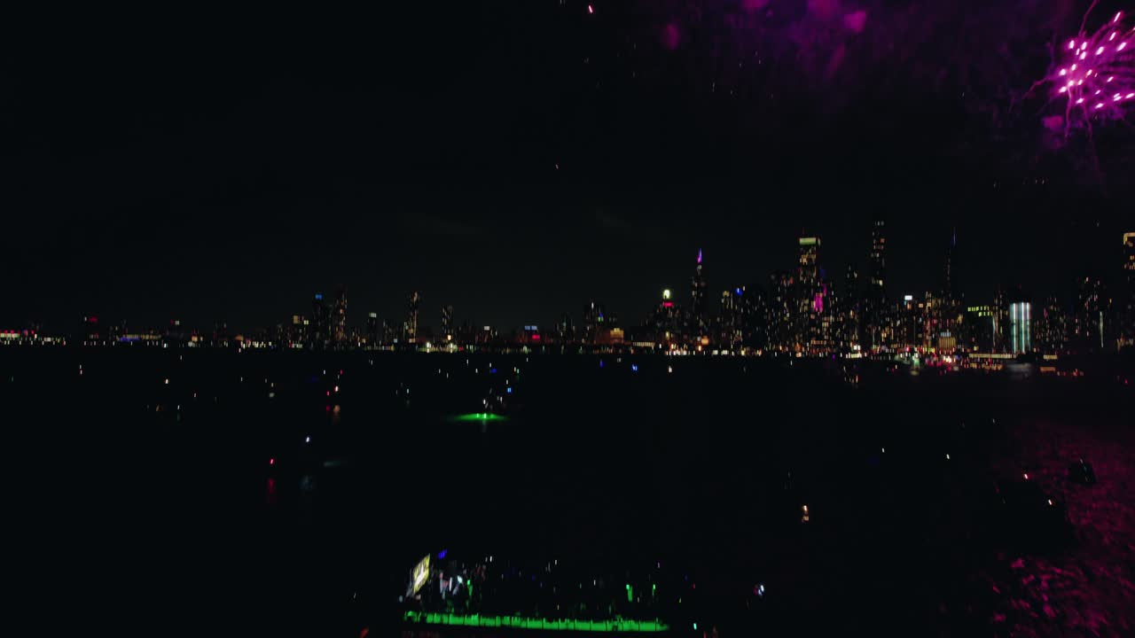 Fireworks blooming over Chicago’s glittering skyline and lakefront at night